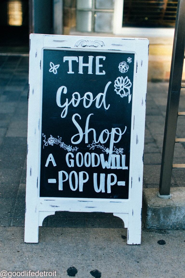 A-frame Chalkboard sign that says The Good Shop A Goodwill Pop-Up